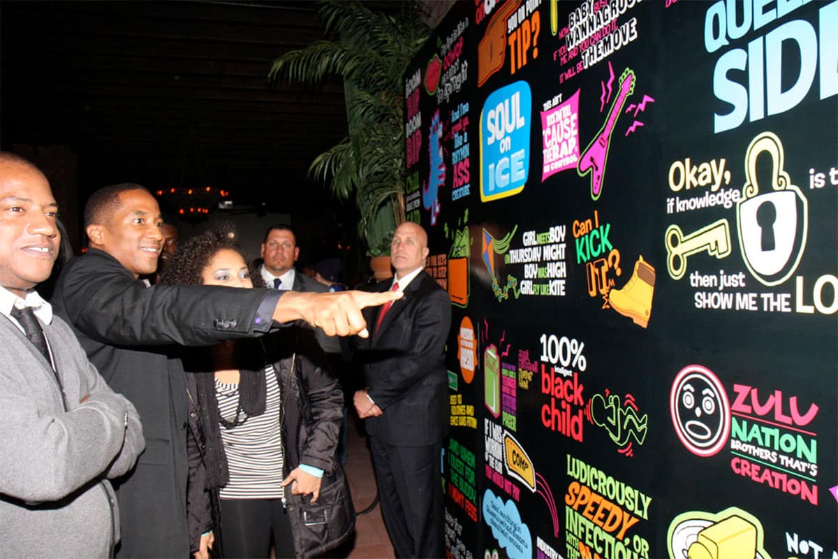 target-q-tip-event-1 Guests at the Target × Q-Tip event in front of the lyric wall